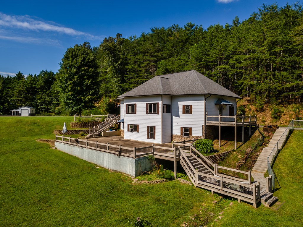 2637 River Road Mineral Bluff, GA 30559 - Photo 2 of 67 a swimming pool with outdoor seating and yard