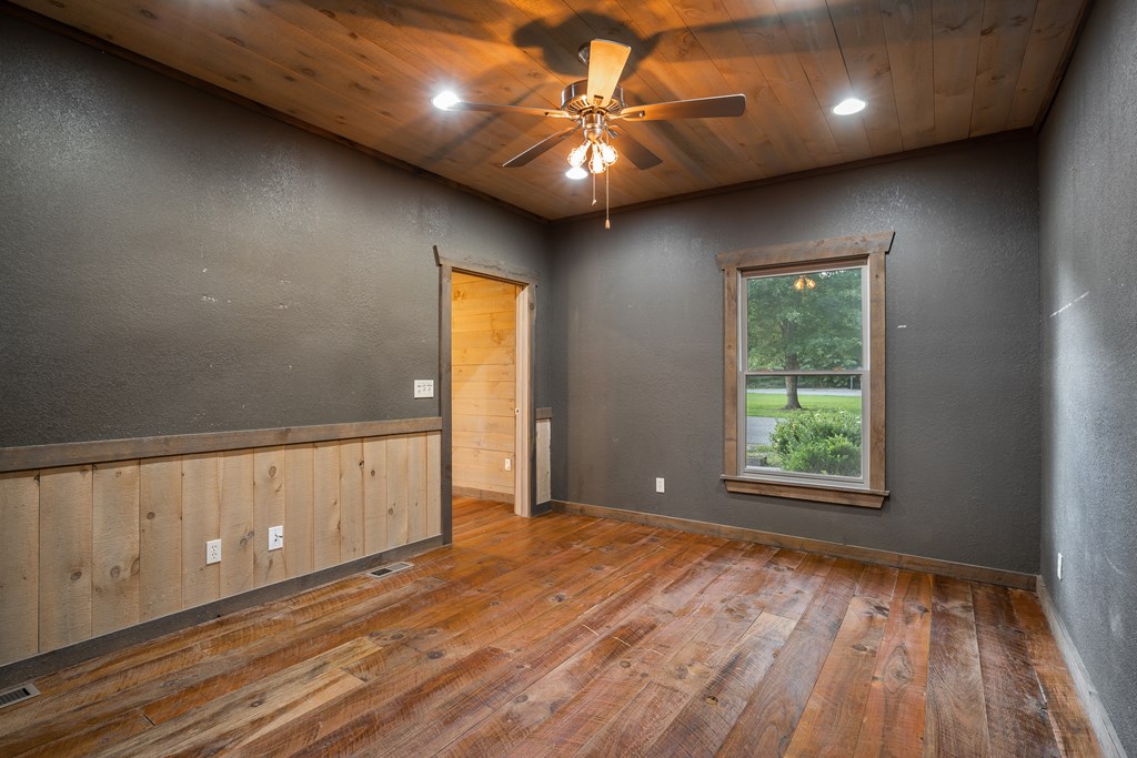2637 River Road Mineral Bluff, GA 30559 - Photo 21 of 67 wooden floor in an empty room with a window