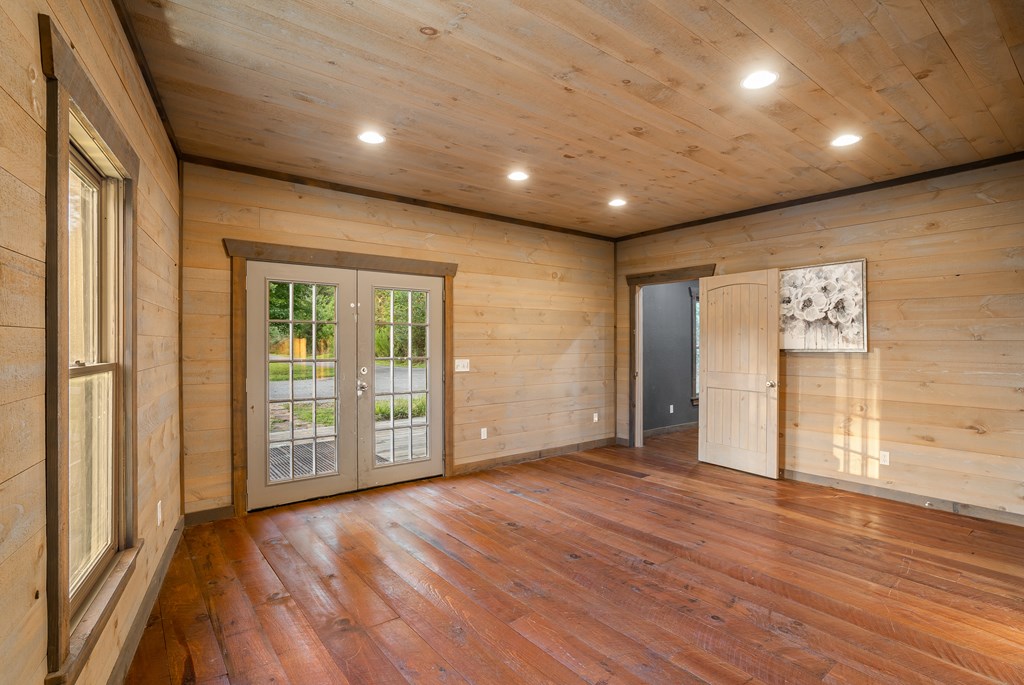 2637 River Road Mineral Bluff, GA 30559 - Photo 31 of 67 a view of an empty room with wooden floor and a window