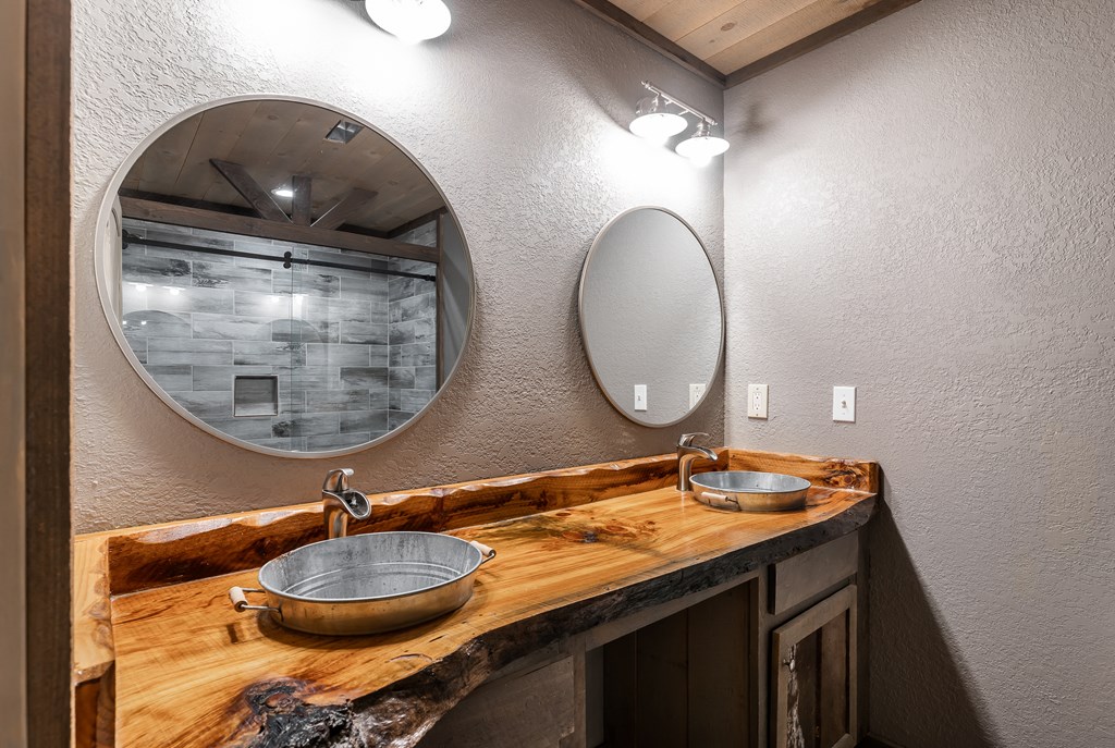 2637 River Road Mineral Bluff, GA 30559 - Photo 34 of 67 a bathroom with a granite countertop double vanity and a mirror