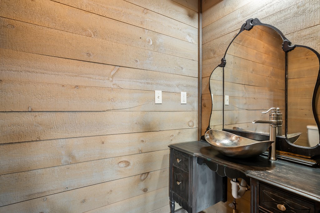 2637 River Road Mineral Bluff, GA 30559 - Photo 46 of 67 a bathroom with a sink and a mirror