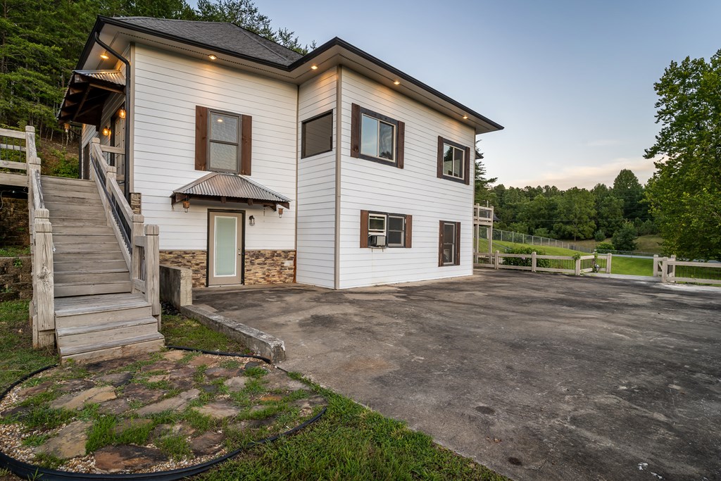 2637 River Road Mineral Bluff, GA 30559 - Photo 47 of 67 a front view of a house with garden