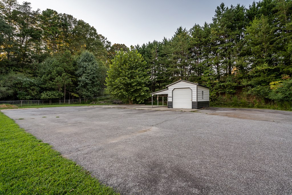 2637 River Road Mineral Bluff, GA 30559 - Photo 48 of 67 a house with trees in front of it
