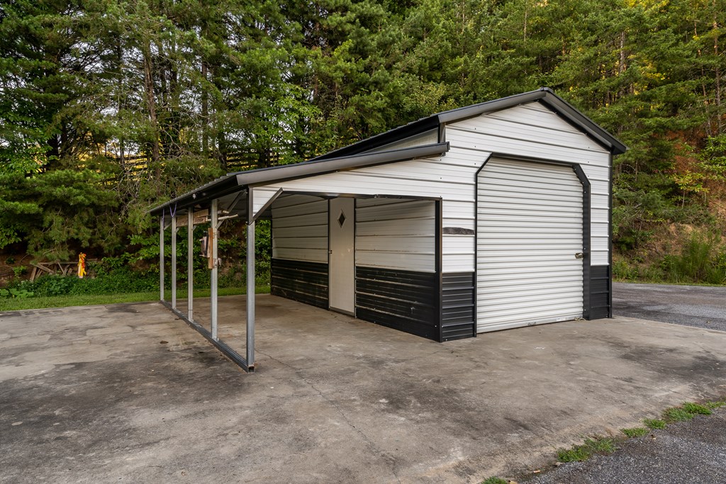 2637 River Road Mineral Bluff, GA 30559 - Photo 49 of 67 a view of a house with a yard and garage