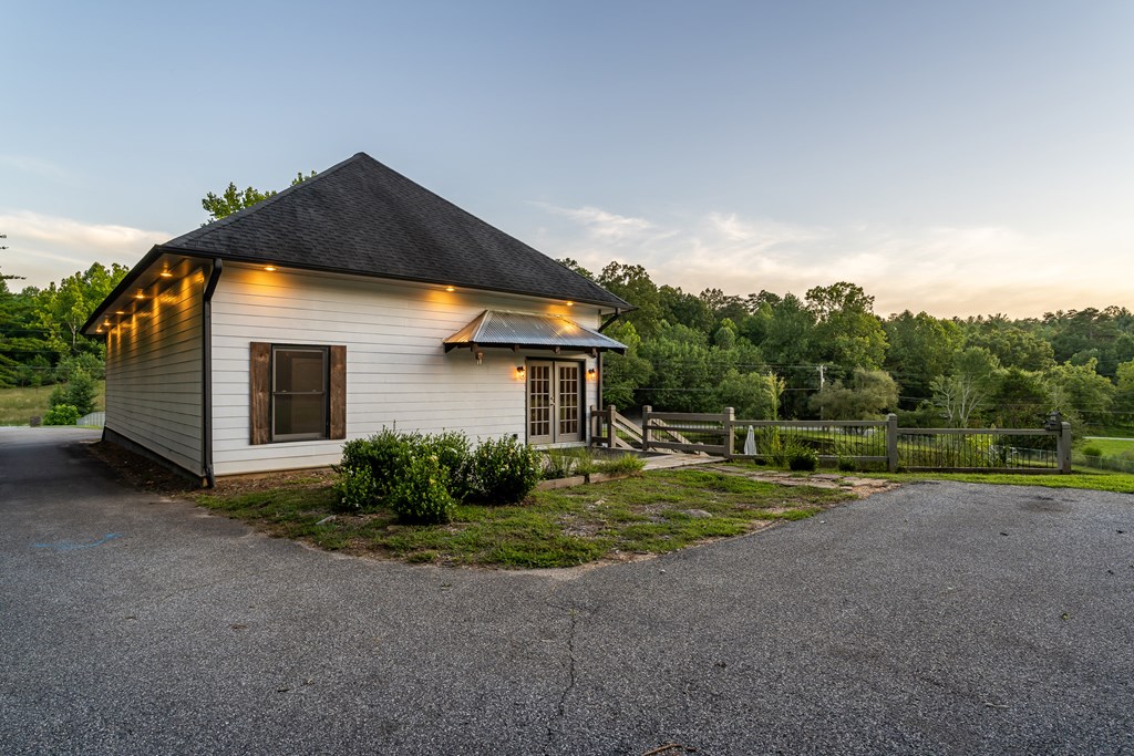 2637 River Road Mineral Bluff, GA 30559 - Photo 54 of 67 a front view of house with yard and trees in the background