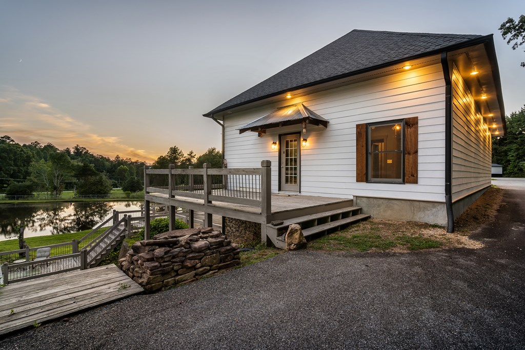 2637 River Road Mineral Bluff, GA 30559 - Photo 6 of 67 a front view of a house with a garden