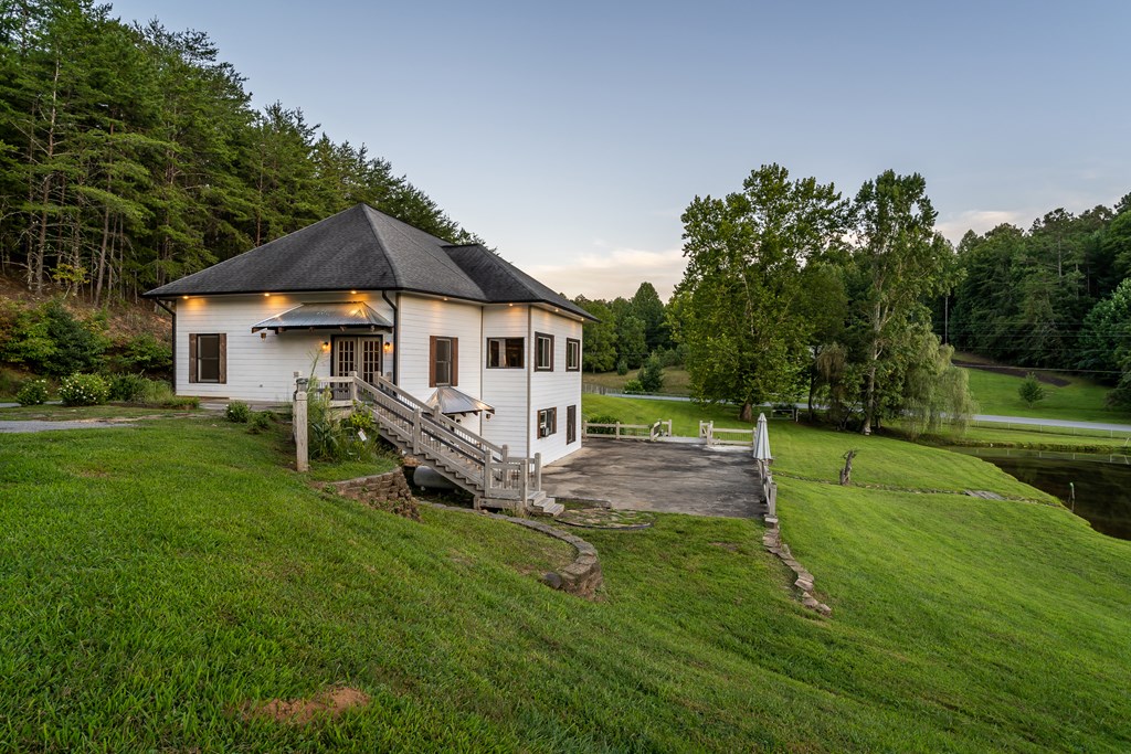 2637 River Road Mineral Bluff, GA 30559 - Photo 61 of 67 a view of a house with a big yard potted plants and large tree