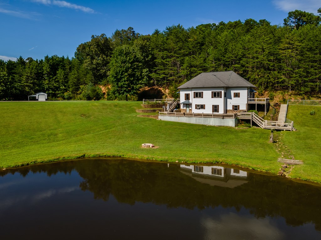 2637 River Road Mineral Bluff, GA 30559 - Photo 64 of 67 a view of a house with a garden