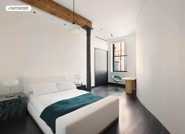 a bedroom with a bed and a couch