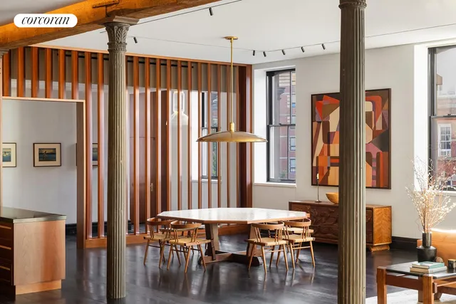 a dining room with furniture and window