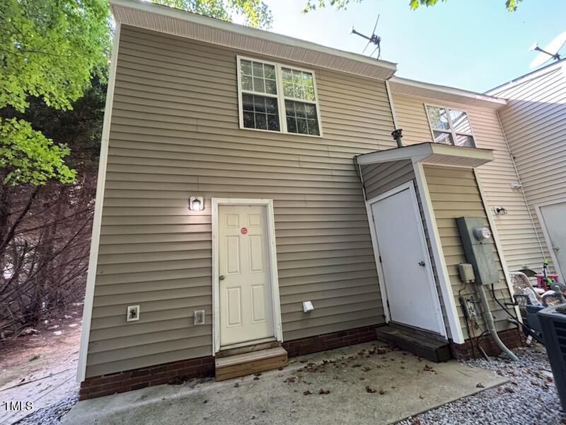 2131 Walnut Bluffs Lane Raleigh, NC 27610 - Photo 2 of 9 a view of a house with a door and a tree
