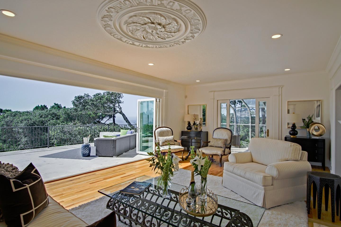 21 Mentone Road Carmel, CA 93923 - Photo 11 of 80 a living room with furniture a table and a large window