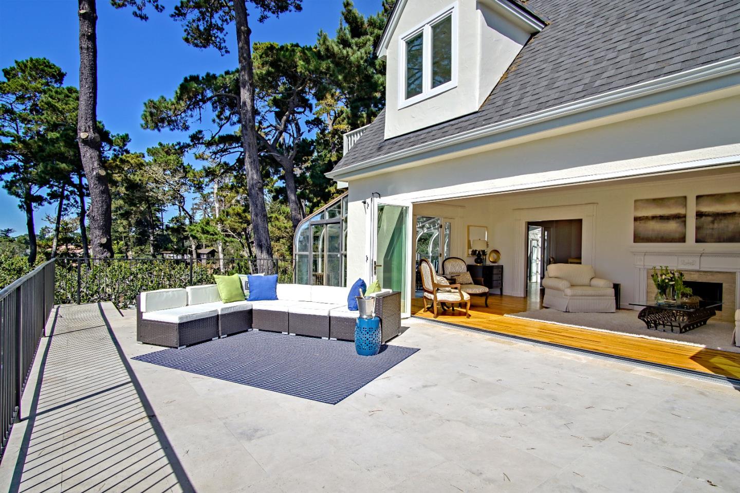 21 Mentone Road Carmel, CA 93923 - Photo 15 of 80 a view of a patio with couches table and chairs with wooden floor and plants