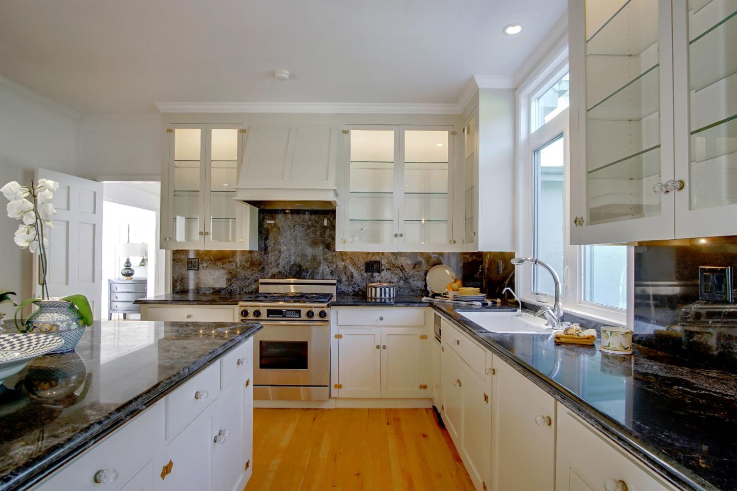 21 Mentone Road Carmel, CA 93923 - Photo 21 of 80 a kitchen with a sink a stove and cabinets