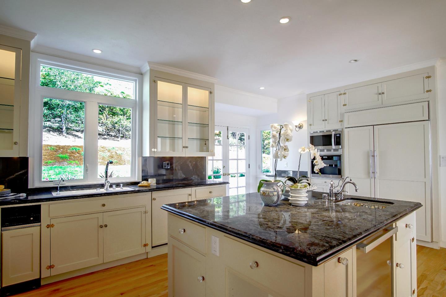 21 Mentone Road Carmel, CA 93923 - Photo 23 of 80 a kitchen with stainless steel appliances granite countertop a sink a stove and cabinets