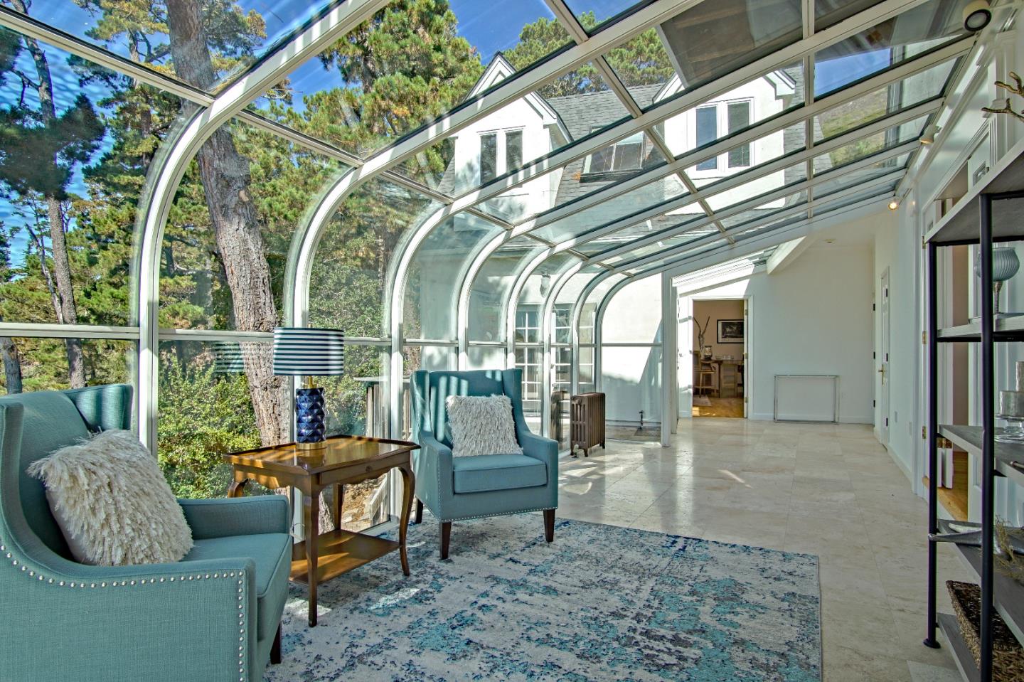 21 Mentone Road Carmel, CA 93923 - Photo 30 of 80 a living room with furniture and a floor to ceiling window
