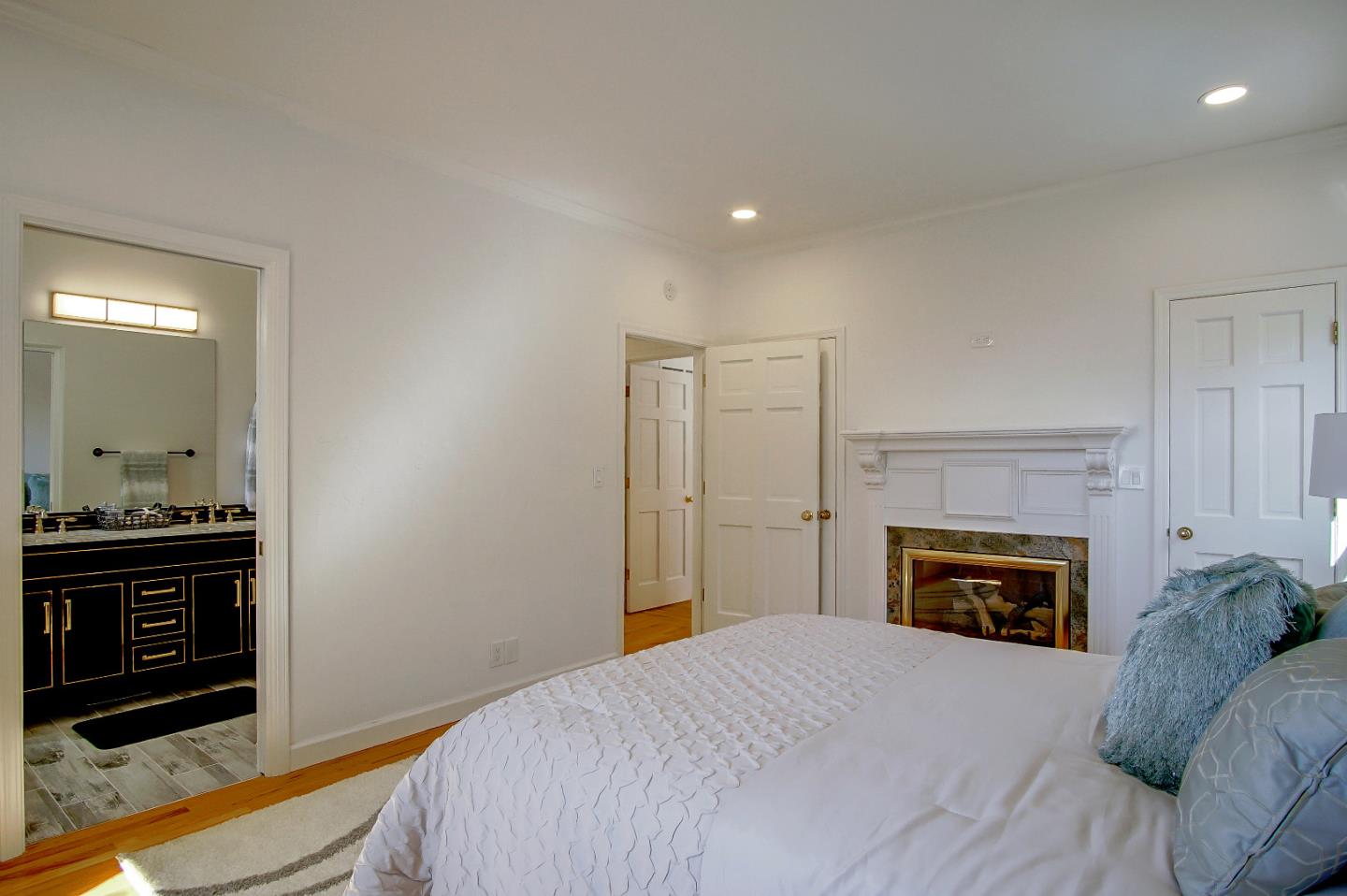 21 Mentone Road Carmel, CA 93923 - Photo 39 of 80 a bedroom with a bed and a fireplace