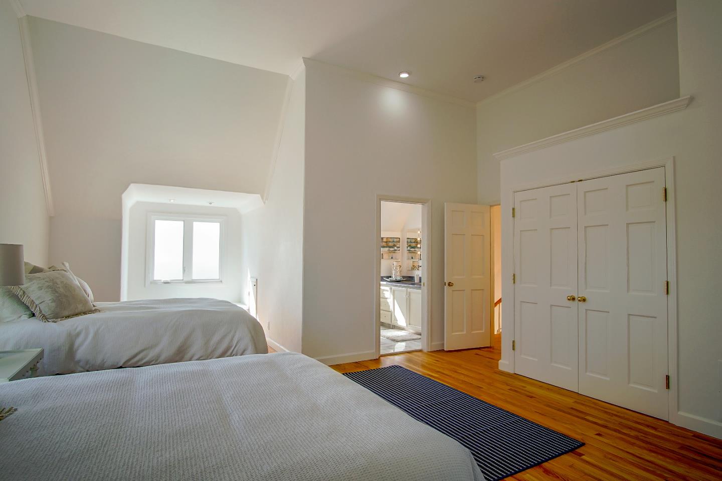 21 Mentone Road Carmel, CA 93923 - Photo 45 of 80 a bedroom with a bed and a window