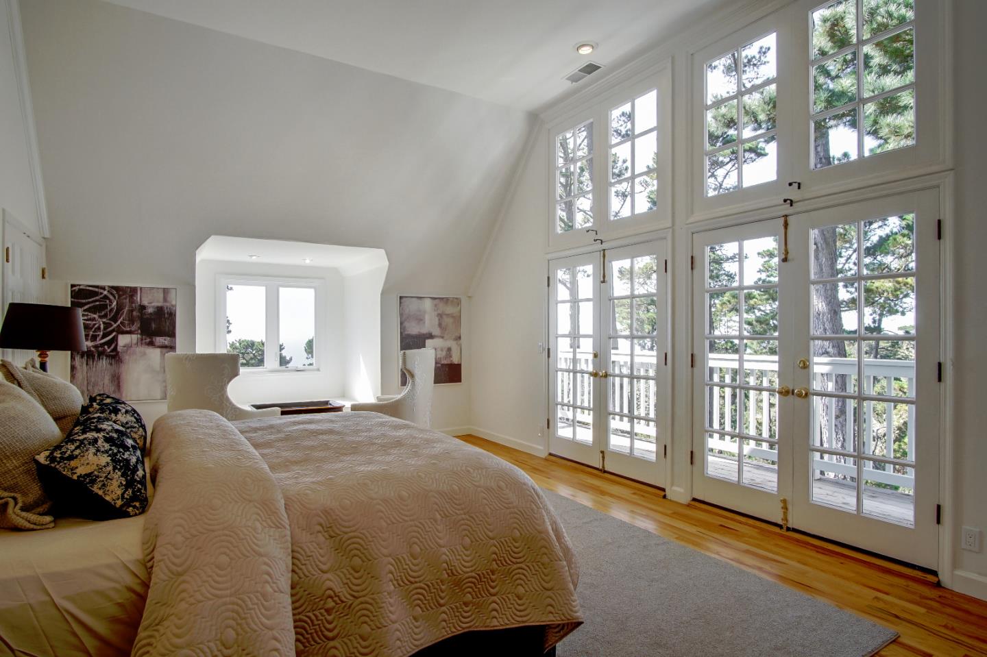 21 Mentone Road Carmel, CA 93923 - Photo 48 of 80 a spacious bedroom with a large bed and a large window