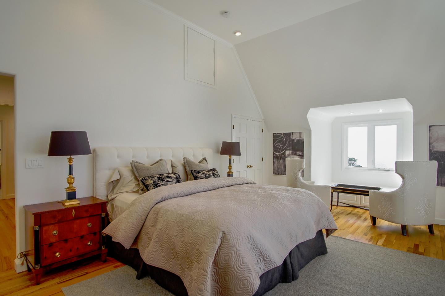 21 Mentone Road Carmel, CA 93923 - Photo 49 of 80 a bedroom with a bed and a lamp on dresser