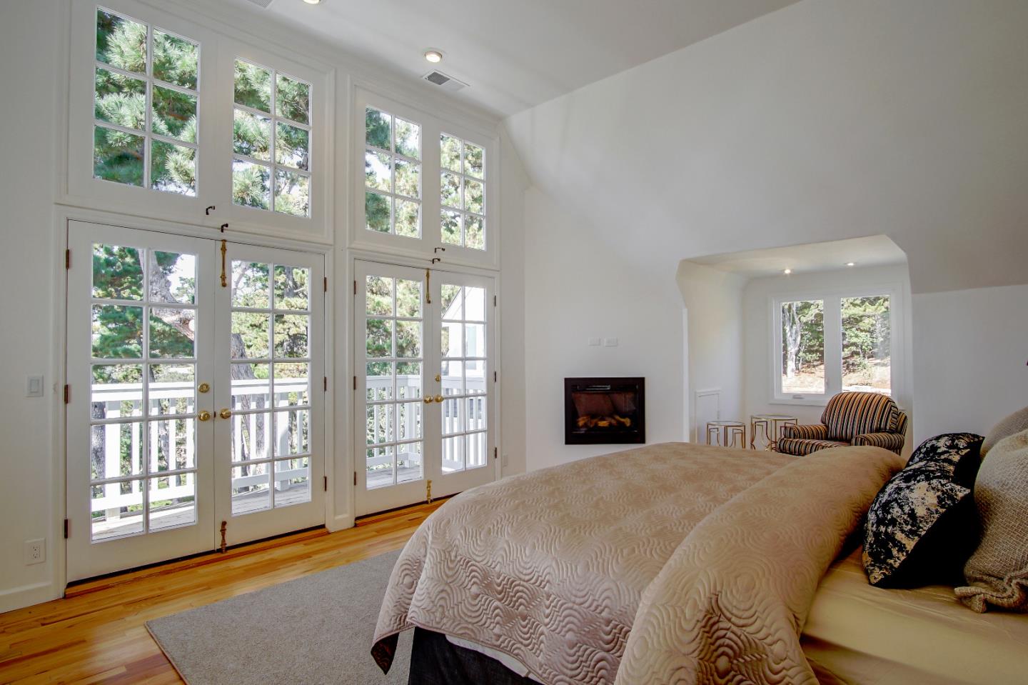 21 Mentone Road Carmel, CA 93923 - Photo 51 of 80 a bedroom with a large bed and a large window