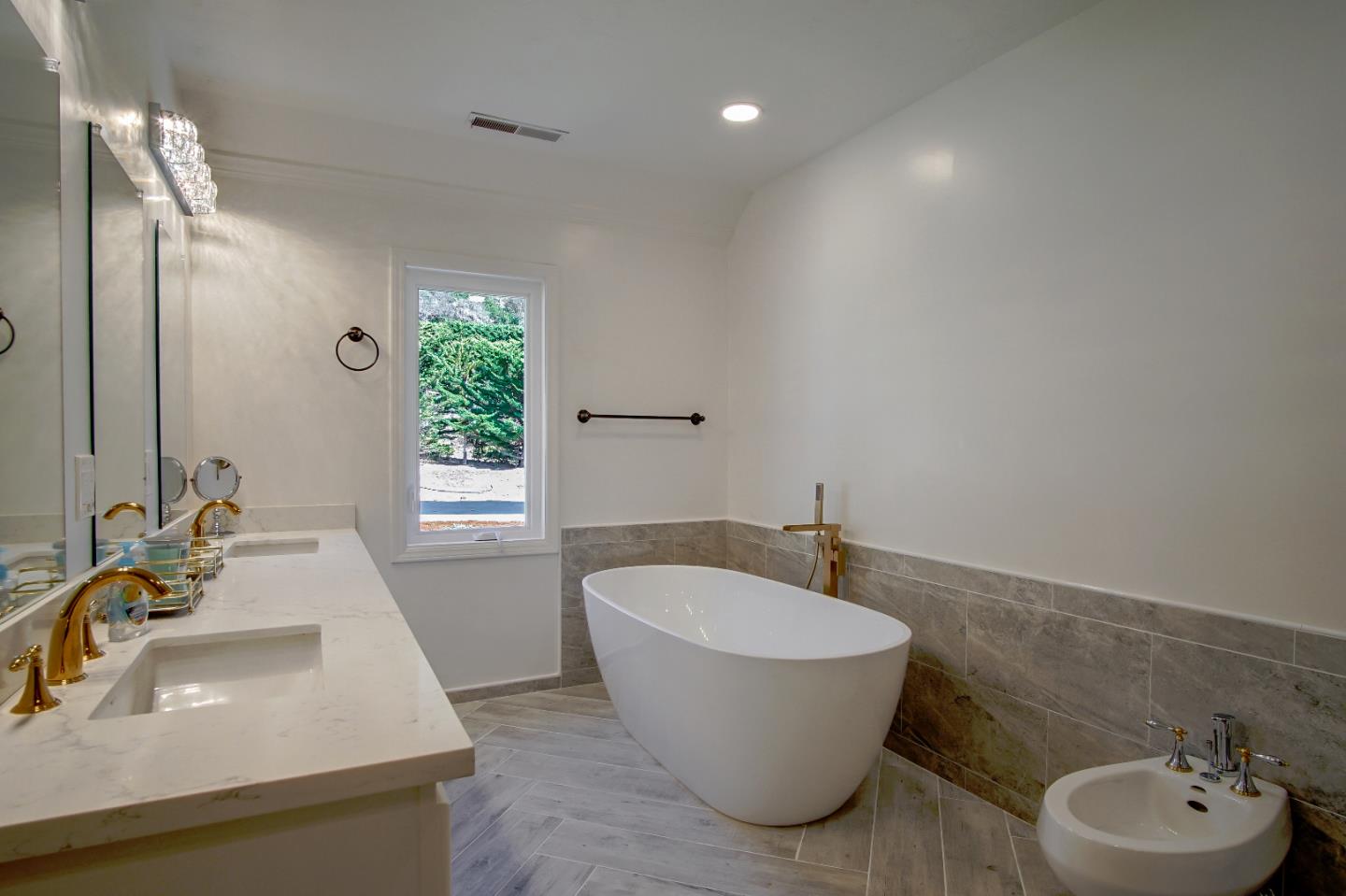 21 Mentone Road Carmel, CA 93923 - Photo 57 of 80 a bathroom with a sink and a mirror