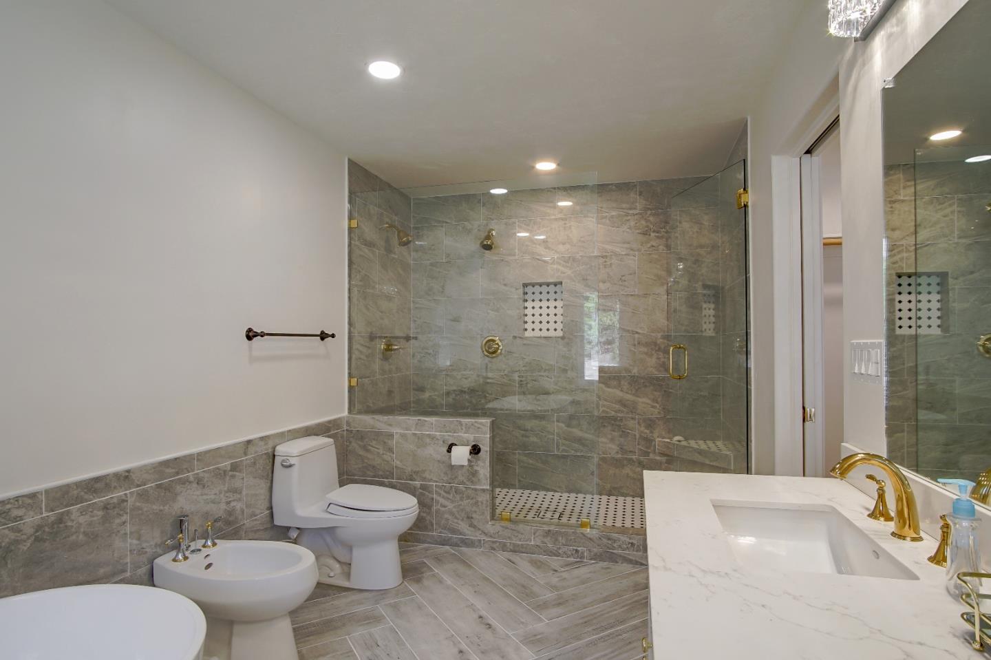 21 Mentone Road Carmel, CA 93923 - Photo 58 of 80 a bathroom with a toilet sink and shower