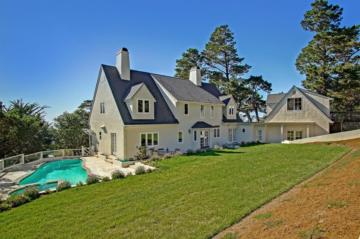 21 Mentone Road Carmel, CA 93923 - Photo 71 of 80 a front view of a house with a garden