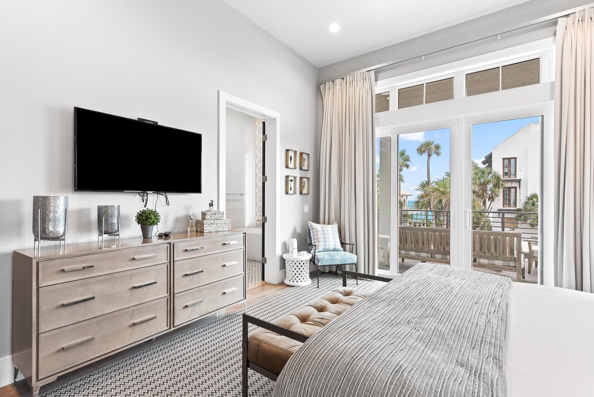 2657 East County Highway 30A Santa Rosa Beach, FL 32459 - Photo 14 of 59 a bedroom with a bed and flat screen tv