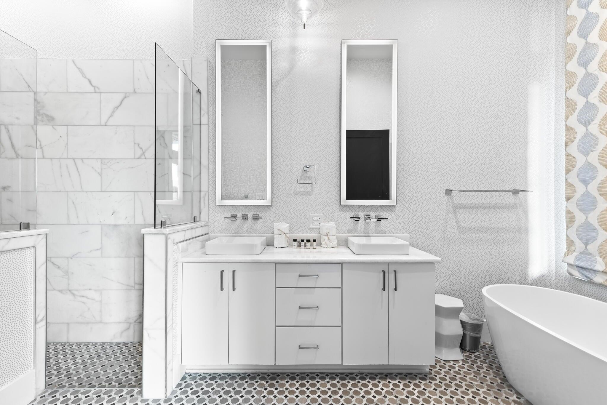 2657 East County Highway 30A Santa Rosa Beach, FL 32459 - Photo 18 of 59 a bathroom with a double vanity sink a toilet and a mirror