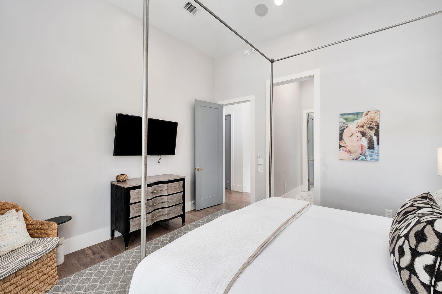 2657 East County Highway 30A Santa Rosa Beach, FL 32459 - Photo 21 of 59 a bedroom with a bed and a flat screen tv