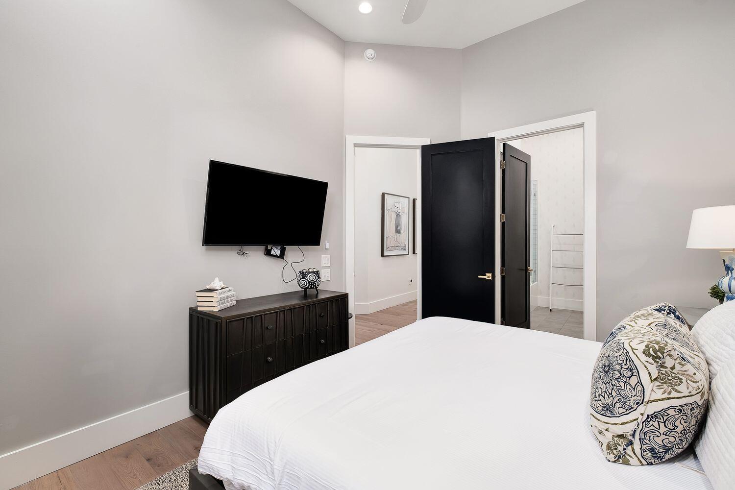 2657 East County Highway 30A Santa Rosa Beach, FL 32459 - Photo 24 of 59 a bedroom with a bed and a flat screen tv