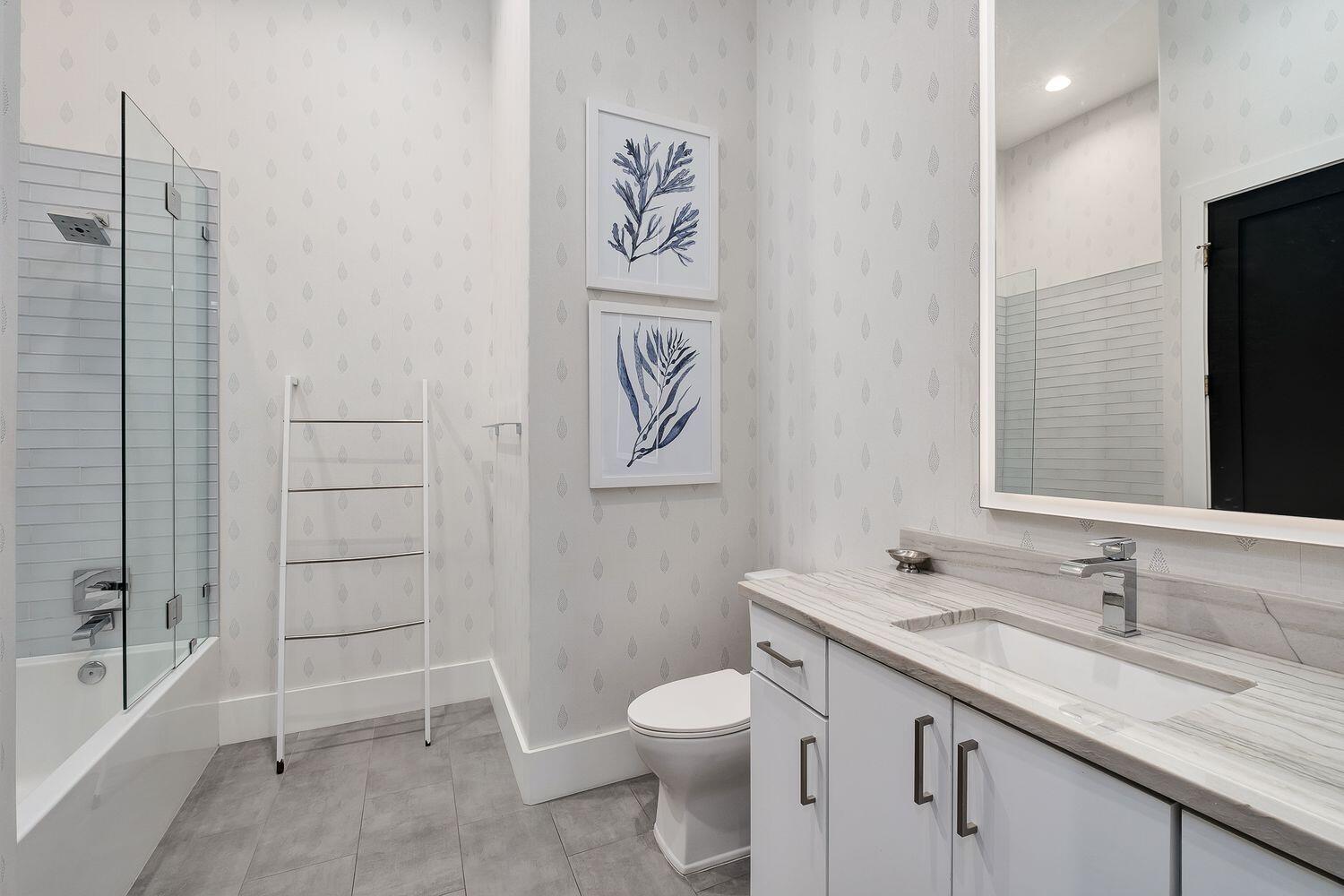 2657 East County Highway 30A Santa Rosa Beach, FL 32459 - Photo 25 of 59 a bathroom with a granite countertop sink toilet and shower