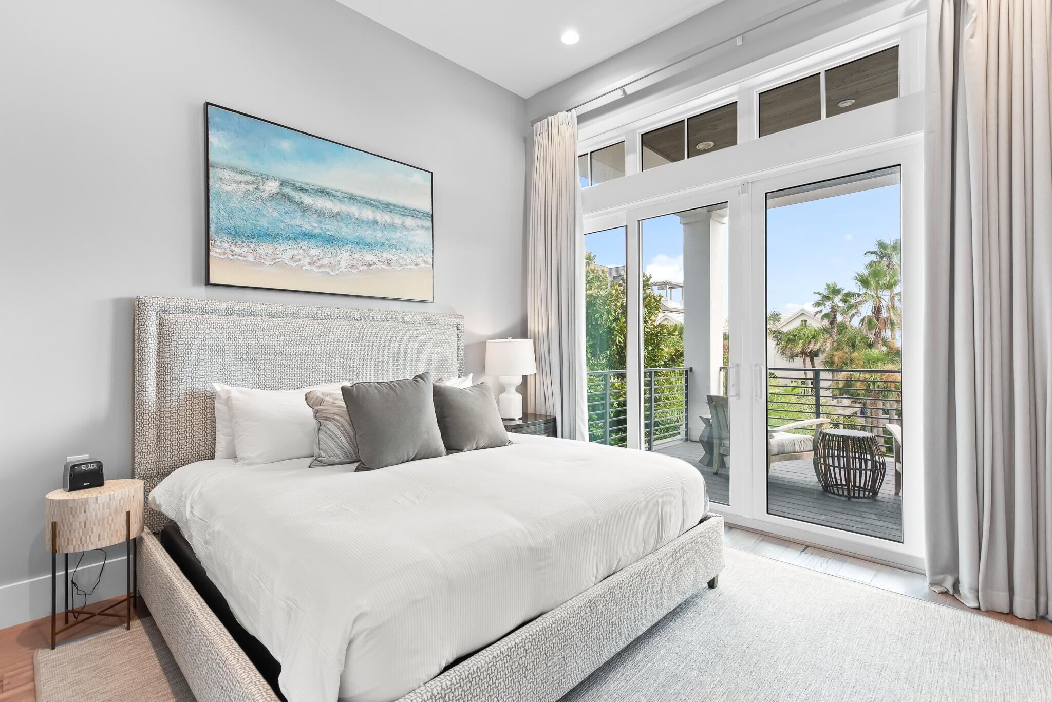 2657 East County Highway 30A Santa Rosa Beach, FL 32459 - Photo 31 of 59 a bedroom with a large bed and a large window