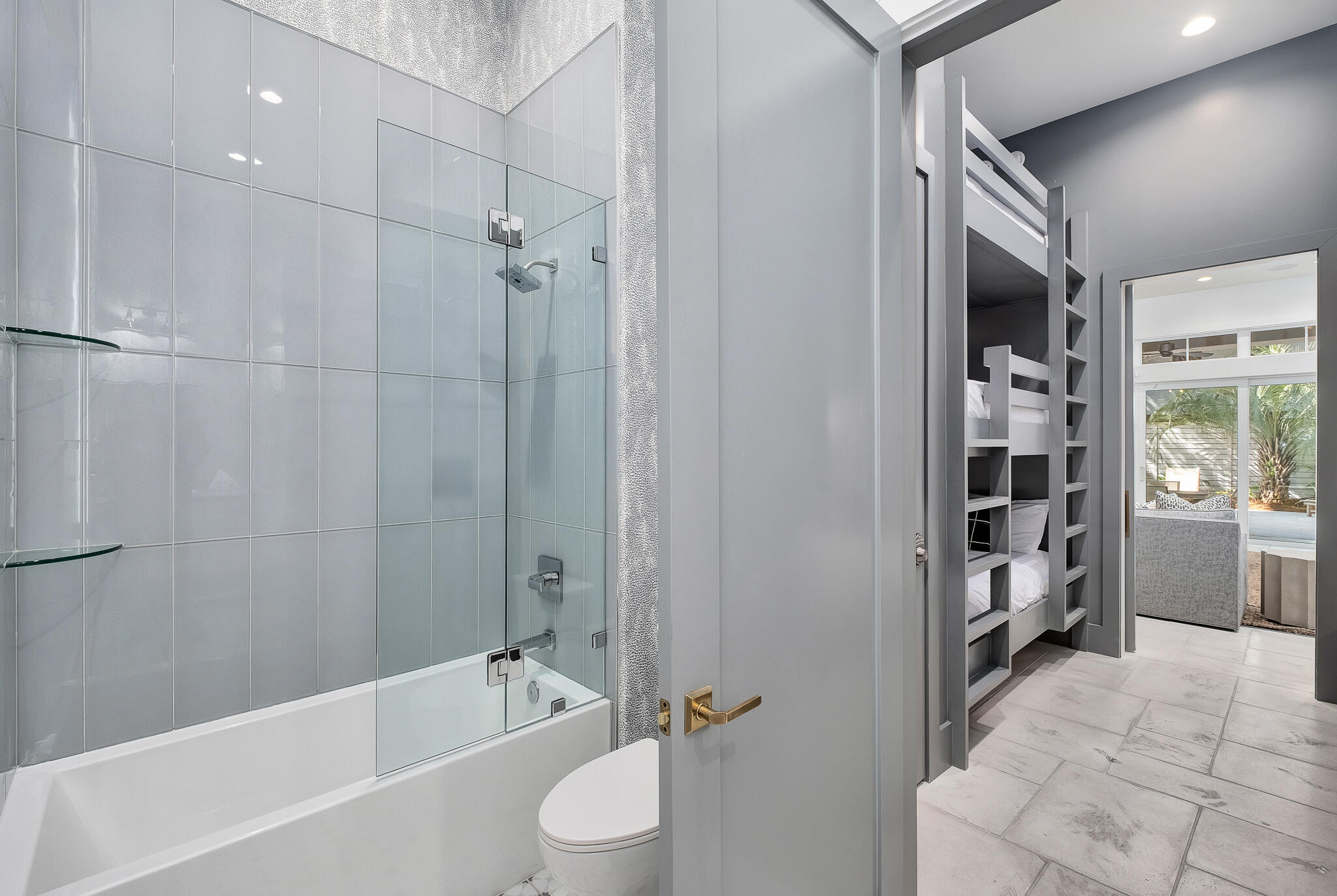 2657 East County Highway 30A Santa Rosa Beach, FL 32459 - Photo 44 of 59 a bathroom with a bathtub a toilet and a shower