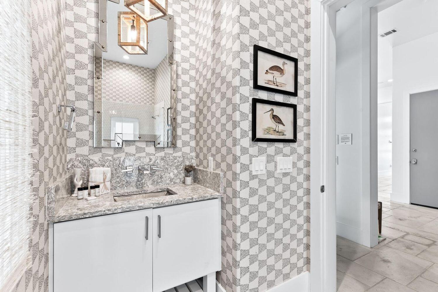 2657 East County Highway 30A Santa Rosa Beach, FL 32459 - Photo 48 of 59 a bathroom with a sink and a mirror