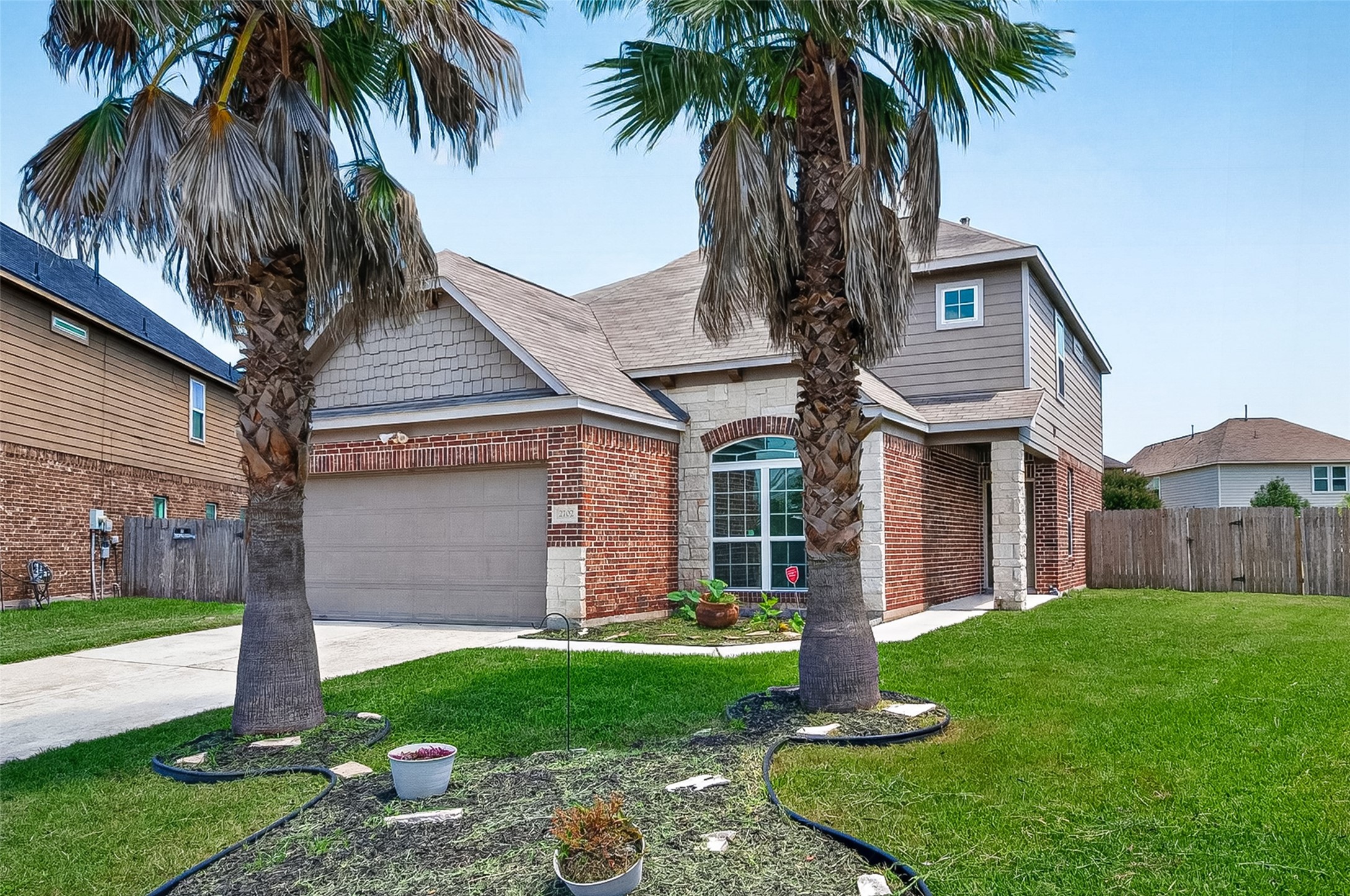2702 Modano Court Fresno, TX 77545 - Photo 2 of 46 a front view of house with yard and green space