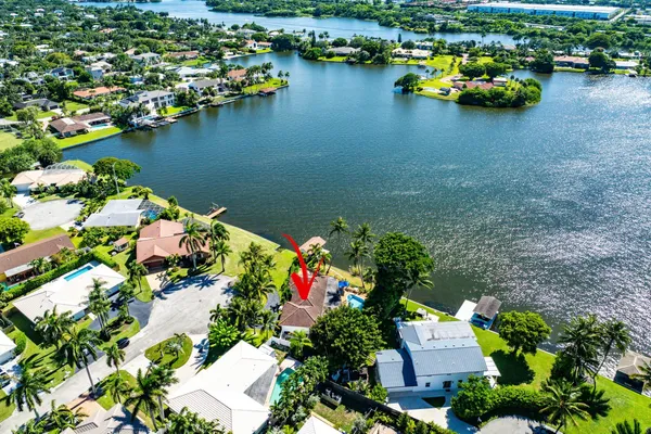 an aerial view of a houses with yard