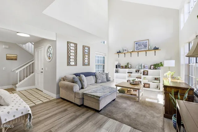 a living room with furniture and a table