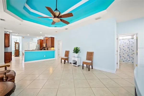 a lobby with furniture and a potted plant