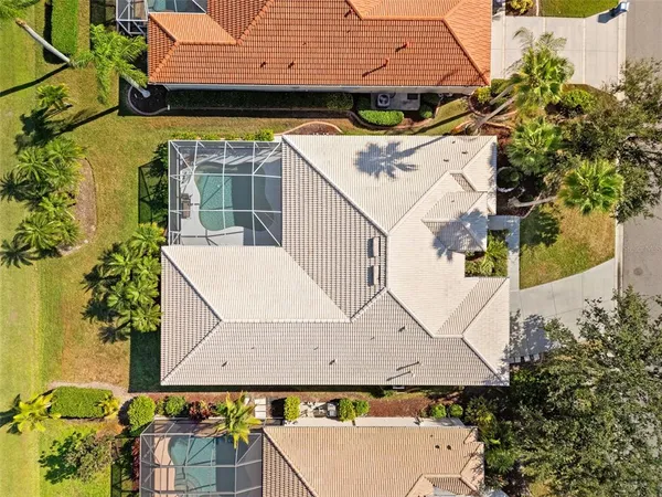 an aerial view of a house with swimming pool