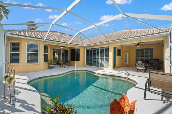 a view of a swimming pool with a patio