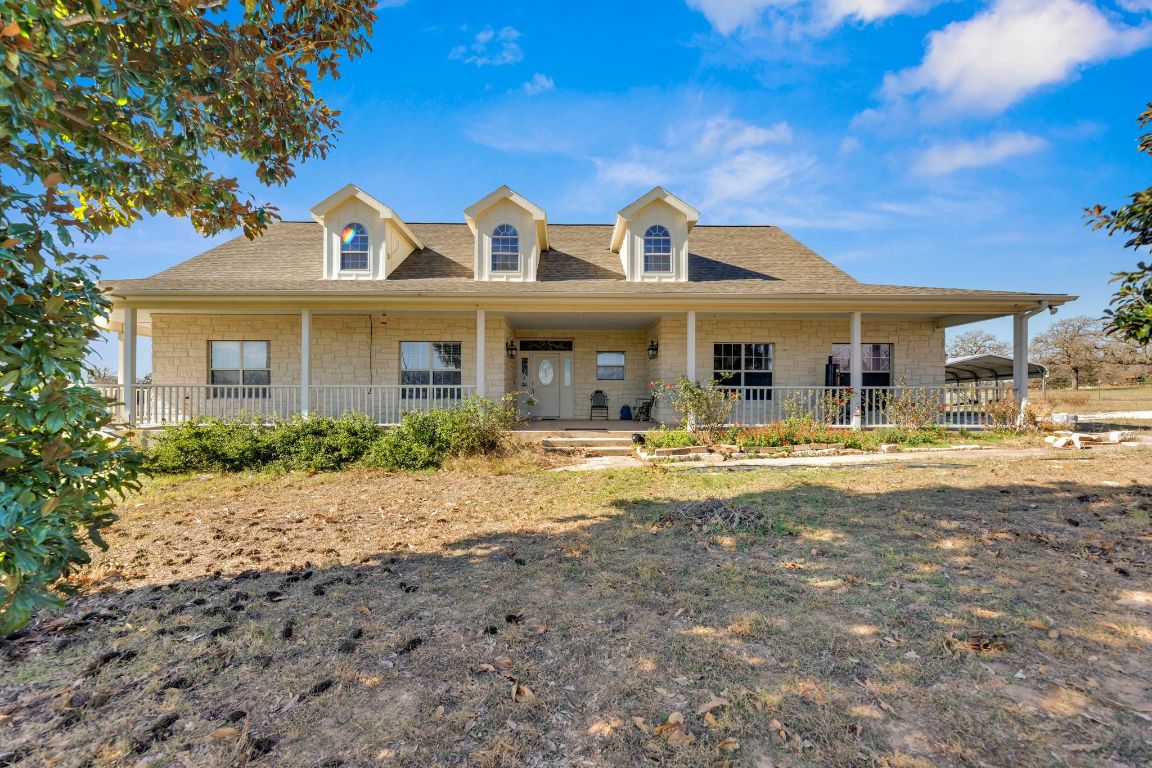 a front view of a house with swimming pool