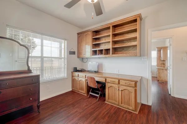 a view of cabinets and wooden floor