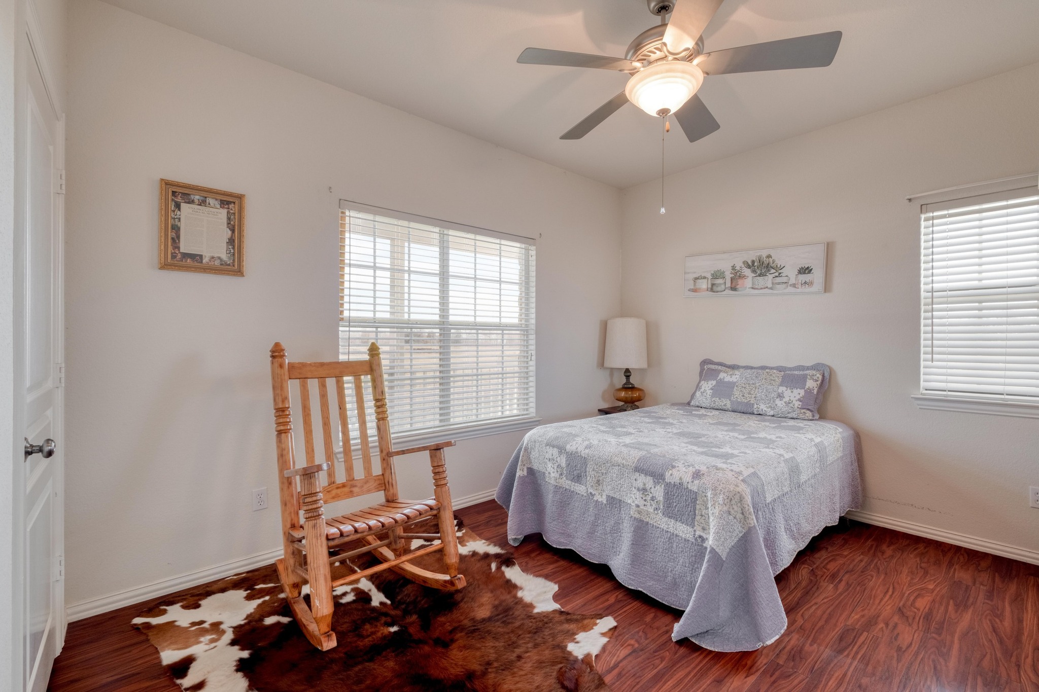 1949 Farm To Market Road 619 Elgin, TX 78621 - Photo 16 of 32 a bedroom with a bed and a chandelier