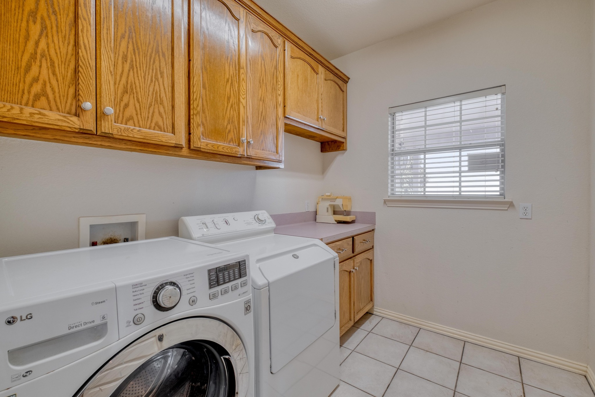 1949 Farm To Market Road 619 Elgin, TX 78621 - Photo 18 of 32 a utility room with dryer and washer