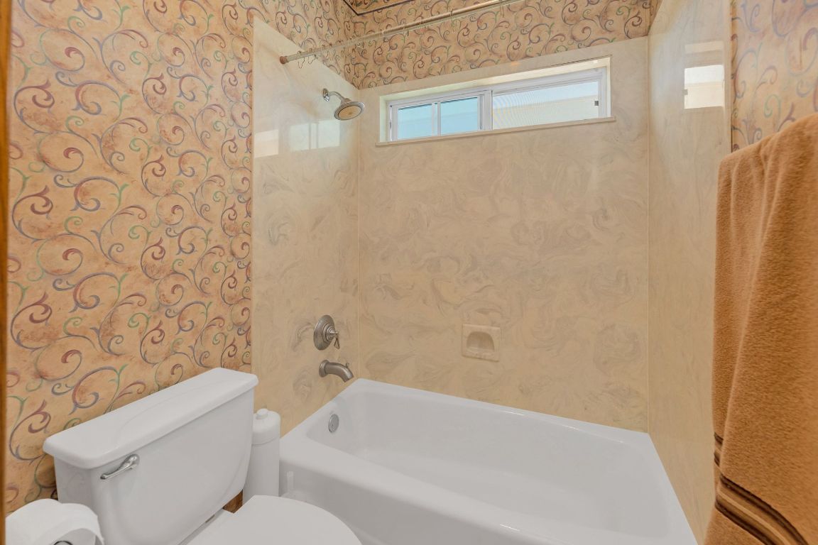 1949 Farm To Market Road 619 Elgin, TX 78621 - Photo 22 of 36 a bathroom with a toilet and a bathtub