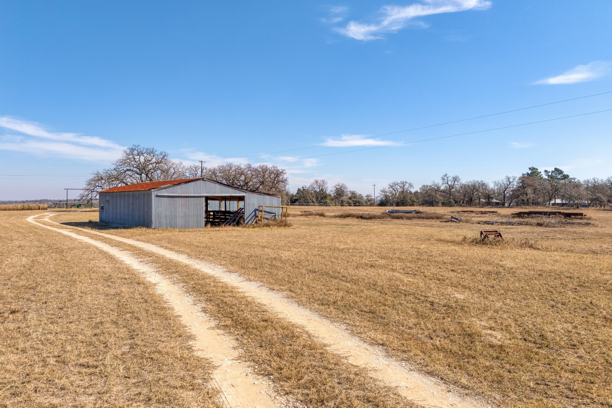 1949 Farm To Market Road 619 Elgin, TX 78621 - Photo 24 of 32 a view of a lake with a big yard