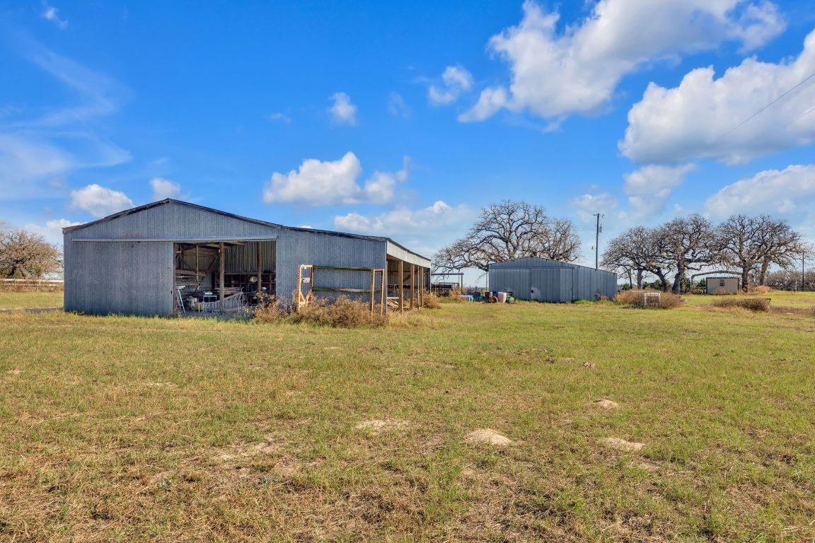 1949 Farm To Market Road 619 Elgin, TX 78621 - Photo 34 of 36 a front view of a house with a yard and mountain view