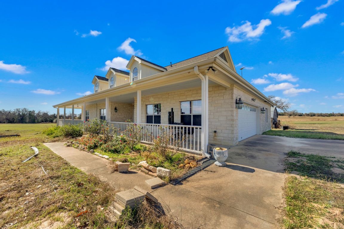 1949 Farm To Market Road 619 Elgin, TX 78621 - Photo 5 of 36 a view of a house with a yard